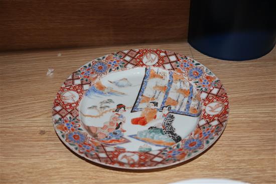 A Chinese porcelain bowl, decorated with figures in reserves on an iron red ground and two other items,